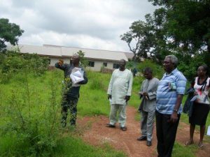 SITE-SEEING-SOME-FOUNDATION-MEMBERS-SURVEY-THE-GROUNDS-FOR-THE-FIRST-FOUNDATION-BUILDING-300x225